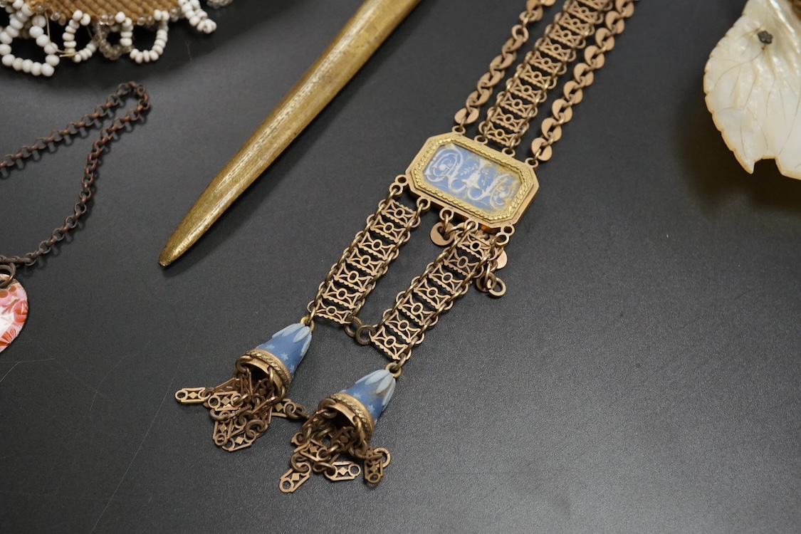 19th century objects to include a bronze lion paperweight, a Palais Royale chamberstick, a beadwork pocket, chatelaine etc
